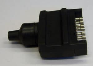 This photo shows a 7-pin male socket/connector for a WeedSwiper. It has a row of metal connectors.